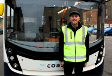 Andrew Clayton in front of bus