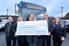 Guildford Depot team handover large cheque to Shooting Star Children's Hospice