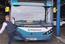 Angela posing infront of autonomous bus