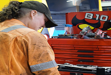 Molly looking at engineering equipment