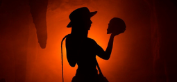 a woman holding a skull shadow