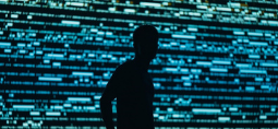 man shadow with coding screen background