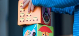 a child playing with bricks