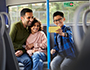image of a family on the bus together