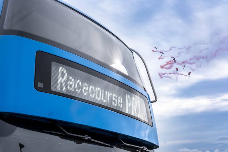 Stagecoach bus with racecourse PR1 on destination screen with parachuters in the sky