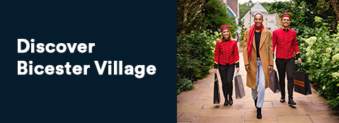 Woman walking down street with people in uniform beside her
